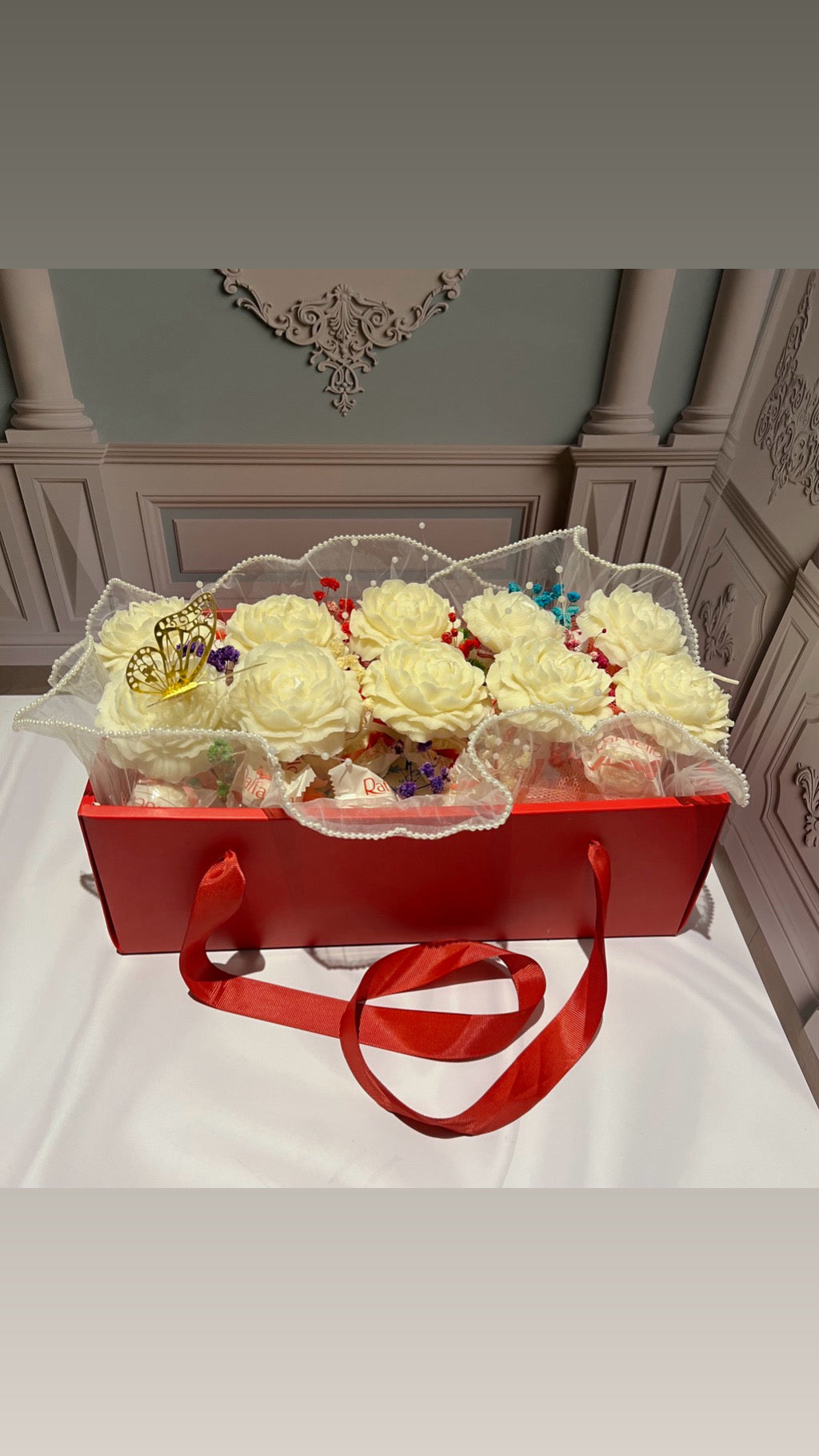 Candle basket, flowers and chocolates