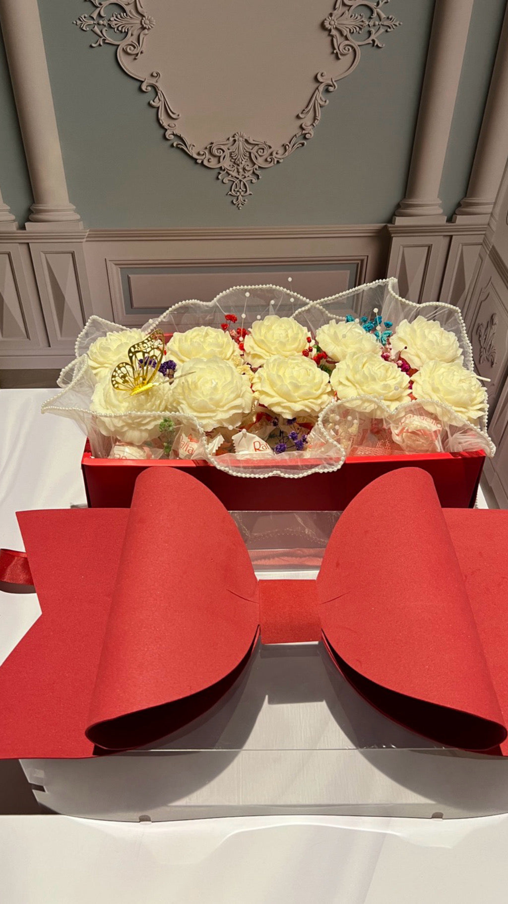 Candle basket, flowers and chocolates